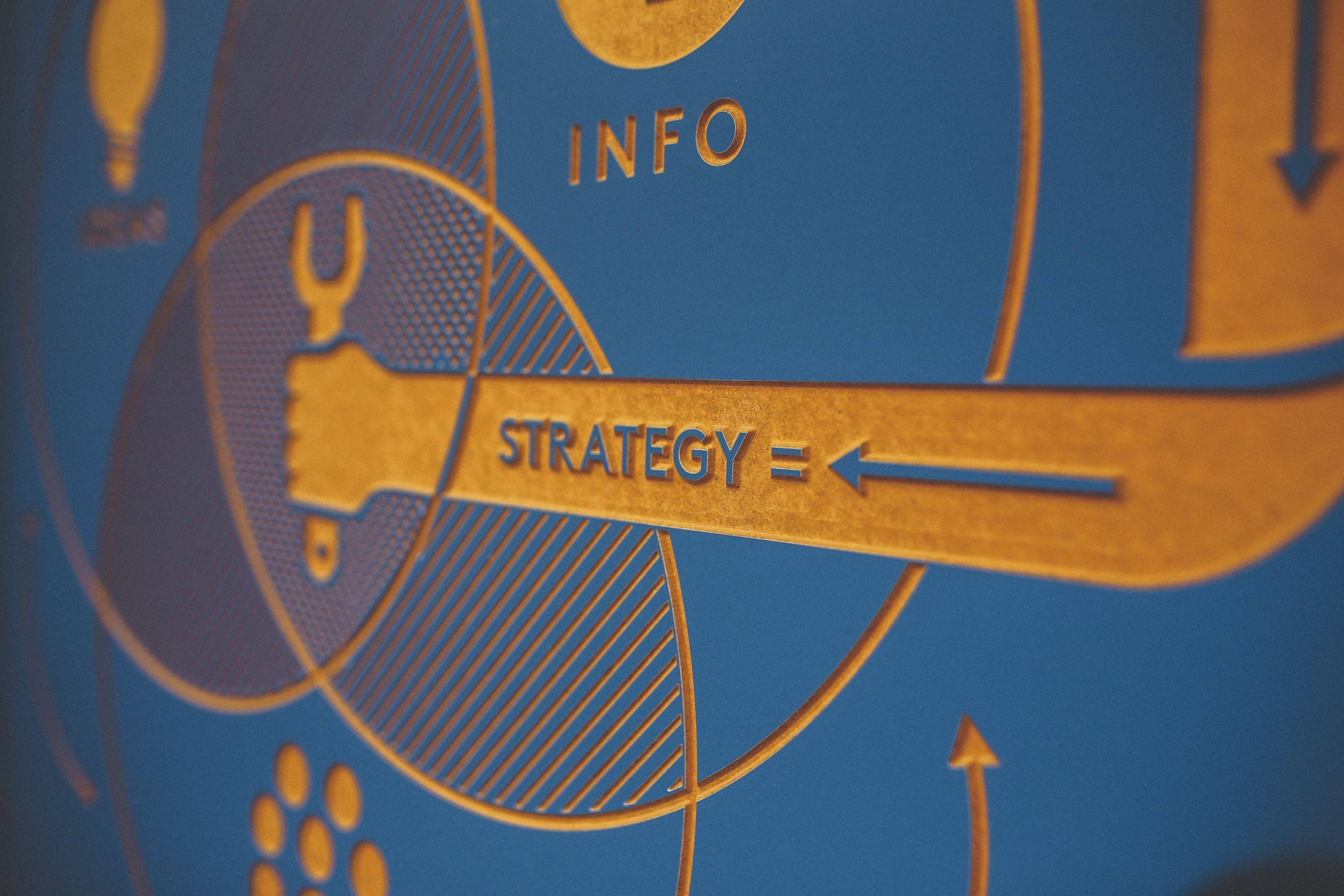 Hand holting a tool with text "strategy"